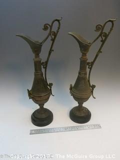 Pair of Middle Eastern metal embossed water pitchers 