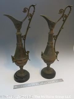 Pair of Middle Eastern metal embossed water pitchers 