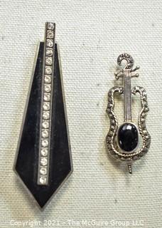 Two Sterling Silver and Marcasite or Rhinestone Brooches.