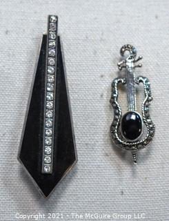 Two Sterling Silver and Marcasite or Rhinestone Brooches.