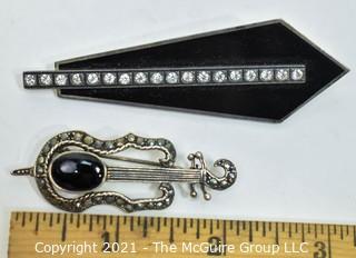 Two Sterling Silver and Marcasite or Rhinestone Brooches.