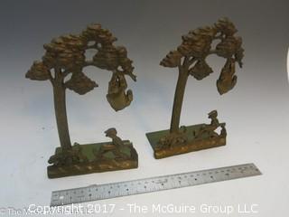 Pair of whimsical brass bookends; Hunter and bear