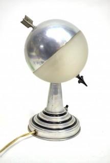 Art Deco Aluminum Globe Hemisphere “Saturn” Swiveling Table Lamp With Brass Arrow Details. Measures: 6"Wide X 6.5" Deep X 9.5" Tall. 