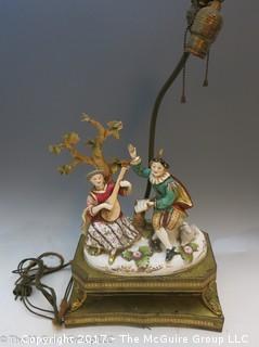 Vintage Porcelain figurative table lamp, fair quality porcelain, missing several leaves on the tree.