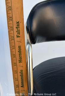 Pair of 1960's Sculptural Chrome and Black Vinyl Bar Stools