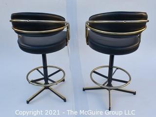 Pair of 1960's Sculptural Chrome and Black Vinyl Bar Stools