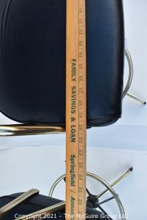 Pair of 1960's Sculptural Chrome and Black Vinyl Bar Stools