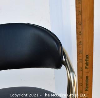 Pair of 1960's Sculptural Chrome and Black Vinyl Bar Stools