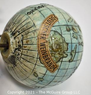 Three (3) Decorative Globes Including a Deutscher Weinbrand Creative World Globe Decanter
