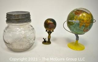 Three (3) Decorative Globe Items Includes Glass Jar, Decorative Figurine and Metal Bank. 