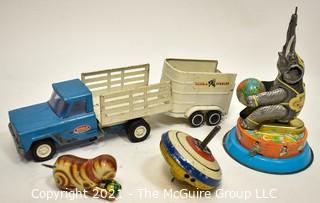 Group of Vintage Toys Including Tonka Truck and Trailer and Tin Litho Wind-Up Toys and Top.