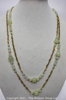 Bowenite Bead Necklace with Gold Tone Chain.  Measures 66" long. 