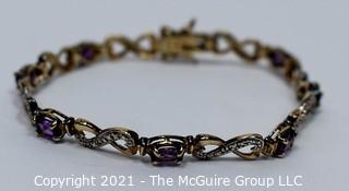 Sterling Silver with Cut Amethyst Mounted Stones Link Bracelet.  Measures 8" long.