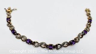 Sterling Silver with Cut Amethyst Mounted Stones Link Bracelet.  Measures 8" long.