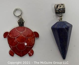 Two Sterling Silver with Semi-precious stone pendants.  Includes Sponge Coral Inlaid Turtle and Lapis Lazuli Cone Shape Pendulum Pendant 