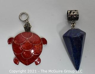 Two Sterling Silver with Semi-precious stone pendants.  Includes Sponge Coral Inlaid Turtle and Lapis Lazuli Cone Shape Pendulum Pendant 