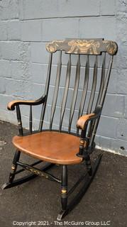 Vintage L. Hitchcock Rocking Chair In Black With Gold Tone Stenciled Accents and Spindle Back.  Clearly marked on the back , ‘L. Hitchcock. Hitchcocksville, Conn Warranted ’ With Backward N’s 