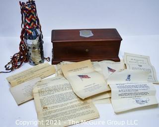 Vintage 1945 Ship Christening Bottle in Presentation Box for the USS Donner.  Bottle is contained in silver case and wrapped in silk ribbons.  Box includes programs and letters from the commissioning ceremony.  