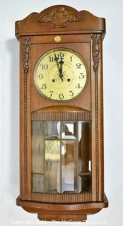 Antique Pendulum Wall Clock in Wood Case with Leaded Glass Made in Western Europe, circa early 1900's.  Measures 12" W x 31" L. 