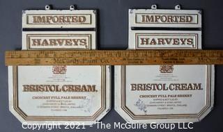 Two (2) Vintage Cast Iron Imported Harveys Bristol Cream Advertising Signs.  Each Measure 11" X 14". 