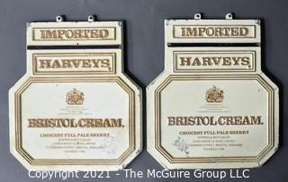 Two (2) Vintage Cast Iron Imported Harveys Bristol Cream Advertising Signs.  Each Measure 11" X 14". 