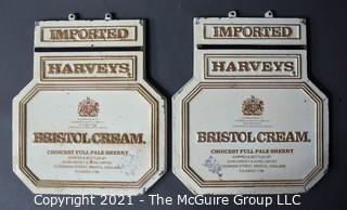 Two (2) Vintage Cast Iron Imported Harveys Bristol Cream Advertising Signs.  Each Measure 11" X 14". 