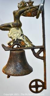 Vintage Wall Mount Cast Iron Bell with Winged Siren on Wave. Some wear to paint. 