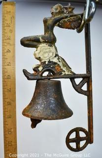 Vintage Wall Mount Cast Iron Bell with Winged Siren on Wave. Some wear to paint. 