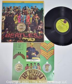 Music 33.3 LP Vinyl Record The Beatles - Sgt. Peppers LHCB, 1969 RE with insert.