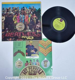 Music 33.3 LP Vinyl Record The Beatles - Sgt. Peppers LHCB, 1969 RE with insert.