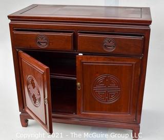 Chinese Rosewood Cabinet With Medallion Motif.  Measures 19" x 34" x 39".