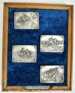 Collection of Four (4) Frederick Remington Belt Buckles Mounted in Frame.  