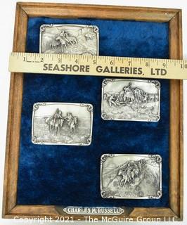 Collection of Four (4) Frederick Remington Belt Buckles Mounted in Frame.  