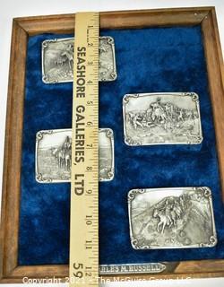 Collection of Four (4) Frederick Remington Belt Buckles Mounted in Frame.  