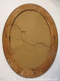 Oval wood grained frame; 19 x 25"