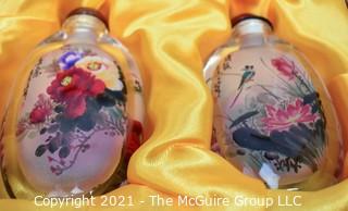 Two (2) Reverse Painted Crystal Snuff Bottles in Presentation Box with Catalog Made by Hengshui Yi-Hu-Zhai Arts & Crafts Co., China. 