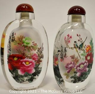 Two (2) Reverse Painted Crystal Snuff Bottles in Presentation Box with Catalog Made by Hengshui Yi-Hu-Zhai Arts & Crafts Co., China. 