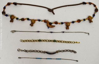 Group of Jewelry Including Bracelets and a Woven Fetish Necklace.