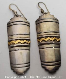 Pair of Vintage 14K Gold and Sterling Silver Pierced Earrings made by Navajo Artists Tommy Secatero (TAS) & Millicent Rogers (MM ROGERS).  They measure 2“ long. 