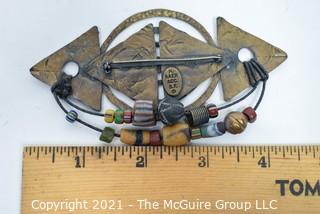 Vintage Artisan Made Hammered Metal Brooch with Native American Trade Beads Brooch Stamped M (Marjorie) Bauer San Francisco.  Measures 4" Wide. 