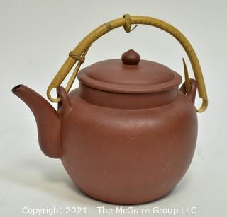 Three (3) Asian Tea Pots Made of Porcelain and Metal.