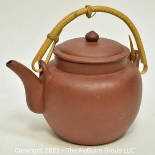 Three (3) Asian Tea Pots Made of Porcelain and Metal.