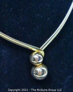 Gold-Tone Torque Style Necklace with Bead Closure. 