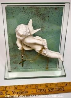 Porcelain Angle Mounted on Glass With Crucifix. Measures 6" x 7". 