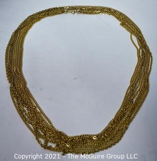 Multi-Strand Gold Tone Necklace.