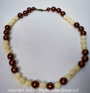 Carved Bone Bead with Faux Copper Pearl Necklace. 24"