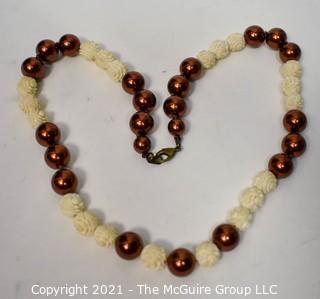 Carved Bone Bead with Faux Copper Pearl Necklace. 24"