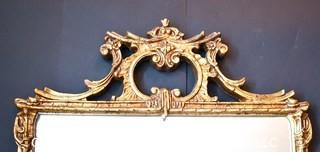 Gilt Framed Wall Mirror With Asian Inspired Decoration.  Measures 26" x 36".