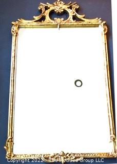 Gilt Framed Wall Mirror With Asian Inspired Decoration.  Measures 26" x 36".