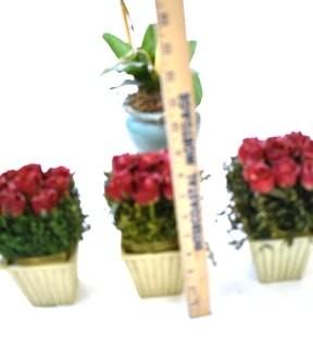 Group of Decorative Faux Flowers in Planters. 